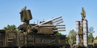 military air defense vehicles on a road