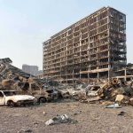Venezuela’s State Vanishes — Chaos Spreads Burned-out cars amid a gutted high-rise building