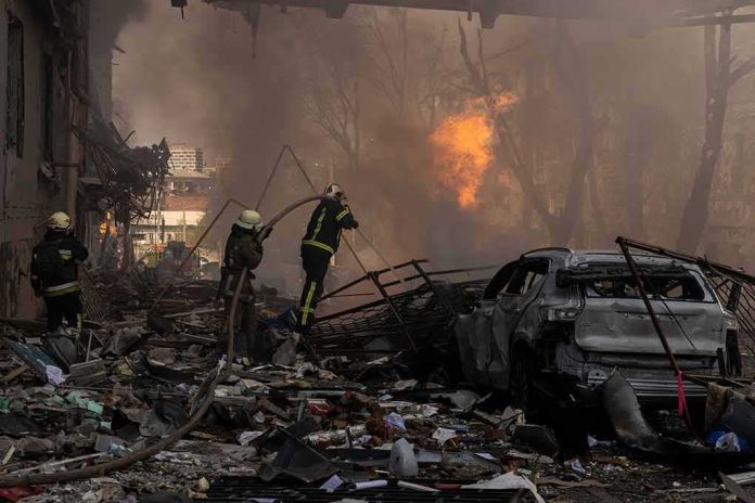 Firefighters tackle blaze amid rubble and a burned car