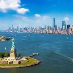 Statue of Liberty overlooking New York Harbor and skyline