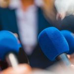 Power Play: Trump Freezes Spy Chief Push Microphones clustered at a press event
