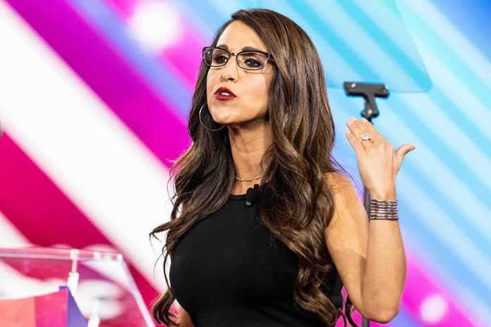 Woman speaking on stage with colorful backdrop