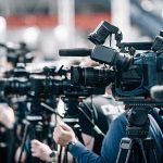 Rent Freeze Chaos—NYC’s Cost Bomb Ticks Broadcast cameras on tripods at a press event