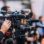 Observers Push Back: No Mass Fraud Video cameras on tripods at a media event