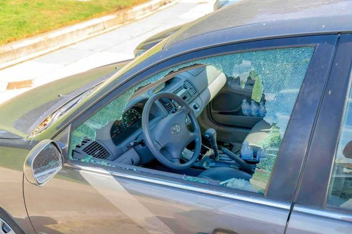 shutterstock_2267097861 Car with shattered driver-side window