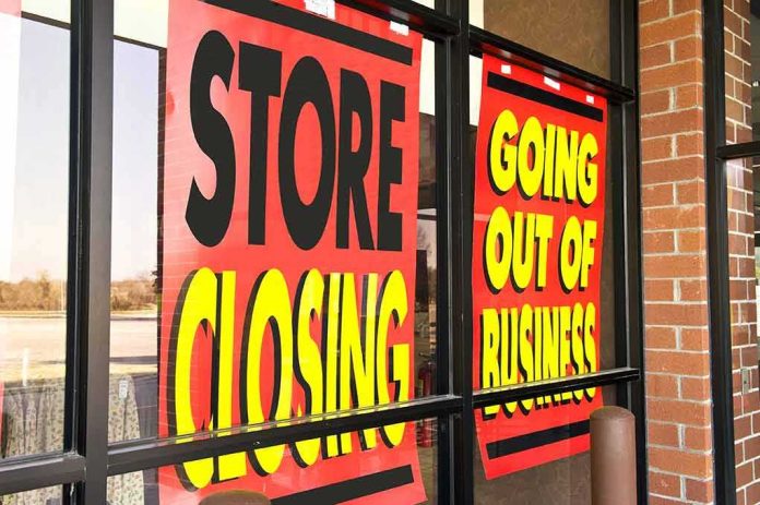 Storefront windows with bright closing sale signs