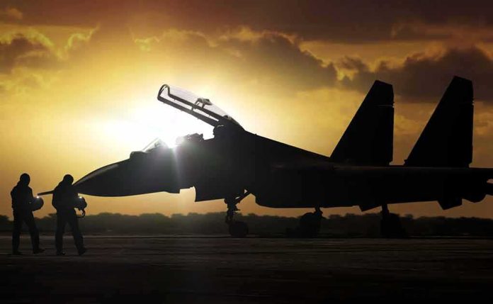 fighter jet on runway at sunset with open canopy