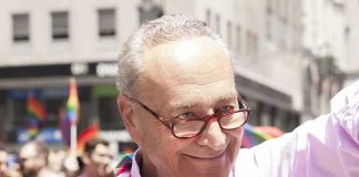 Family Crusade Sparks Nationwide Dragnet Smiling man with a megaphone at a pride parade