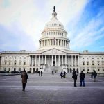 Surveillance Showdown Erupts In Washington United States Capitol building with visitors on the plaza