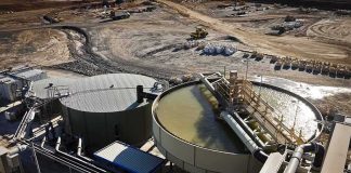 Industrial water treatment tanks at a mining site