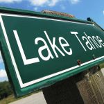 Poison Holes Found – Tahoe Launches $147K Hunt A green directional sign pointing to Lake Tahoe against a blue sky