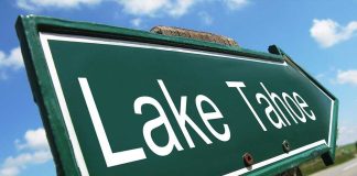 Poison Holes Found – Tahoe Launches $147K Hunt A green directional sign pointing to Lake Tahoe against a blue sky