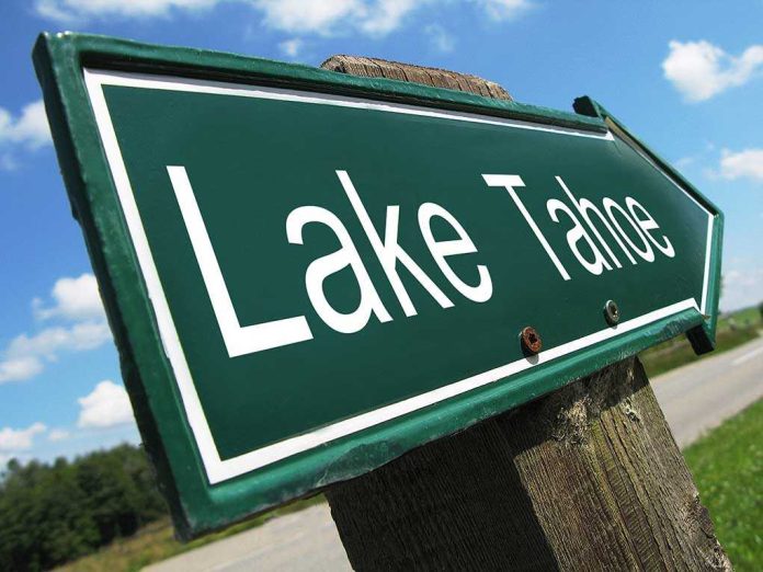 shutterstock_93245149 A green directional sign pointing to Lake Tahoe against a blue sky