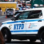 Fifth Avenue Ambush – Hunt Caught On Cameras NYPD police car on a city street scene.