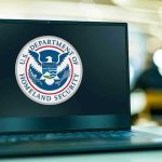 Donor-Tied Jets: Price Jump Stuns Laptop displaying U.S. Department of Homeland Security logo.