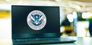 Donor-Tied Jets: Price Jump Stuns Laptop displaying U.S. Department of Homeland Security logo.