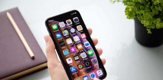 Child-Exploitation Probe Shadows Markle Patriarch Person using a smartphone with apps on the home screen