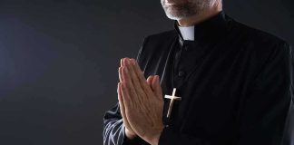 Founder Exposed: Moral Certainty Reached Clergyman in black robe praying with hands together