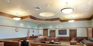 Custody Hearing Ends, 4-Year-Old Is Dead by Night Empty courtroom with wooden benches and judge's bench