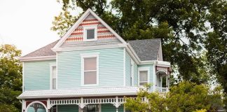 Million-Dollar Fines Hit Wall Street Landlords Victorian house with pastel blue siding and ornate white trim