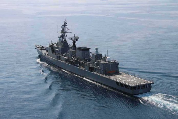 shutterstock_1611527764 Modern naval warship cruising on calm sea