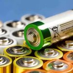 Alkaline batteries stacked with one AA cell on top