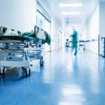 Hospital corridor with empty gurney