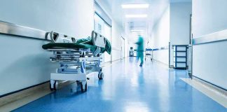 Hospital corridor with empty gurney