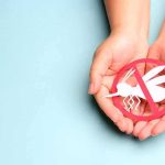 Hands holding a mosquito prohibition symbol