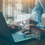 Threat Verdict Shocks Loudoun Schools Person typing on laptop with legal icons overlay