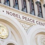 50-Year Vault Cracks – Peace Pick Revealed Nobel Peace Center facade with arched windows and gold medallion
