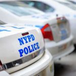 Federal Shooting Sparks Arrests in New York Row of NYPD police cars parked in a line