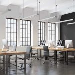 AI Bills Spike – Microsoft Dangles Exit Cash modern open-plan office with large windows and desks