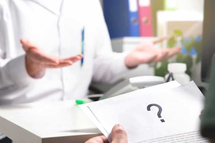 Doctor gesturing during consultation with patient holding paper with question mark