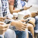 Fee Shock Slams Seattle – Orders Vanish Group of people sitting and using smartphones