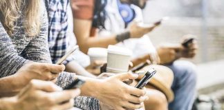 Fee Shock Slams Seattle – Orders Vanish Group of people sitting and using smartphones