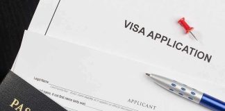 Staged Robberies Explode – Real Bullet Fired Visa application form with passport and pen