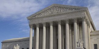 Behind Closed Doors: Breyer Ouster Whispers The Supreme Court building featuring large columns and statues
